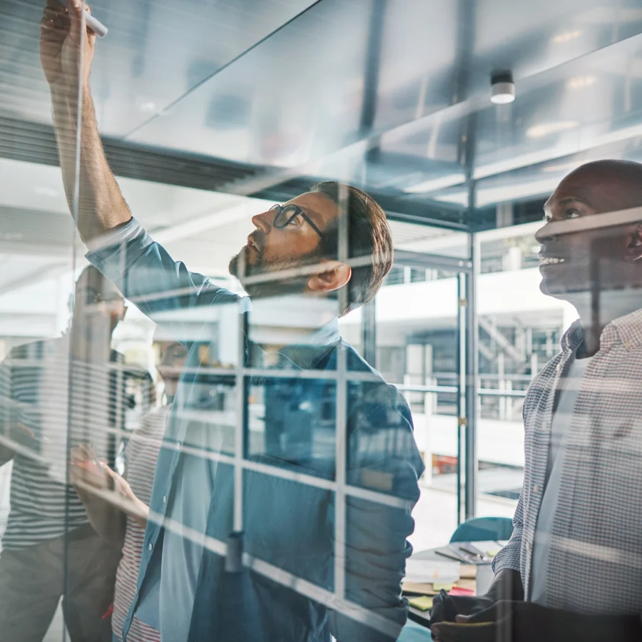 business-professionals-collaborating-on-glass-whit-2026-01-05-00-43-20-utc