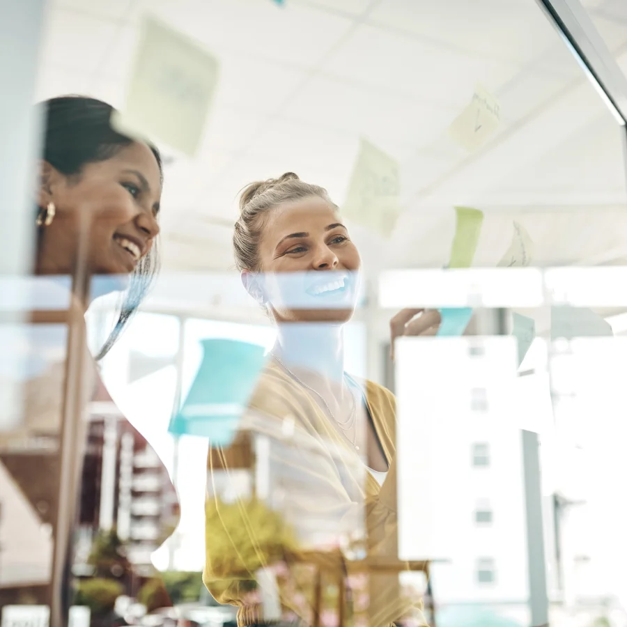 smiling-women-planning-together-in-an-urban-office-2026-01-09-09-50-37-utc